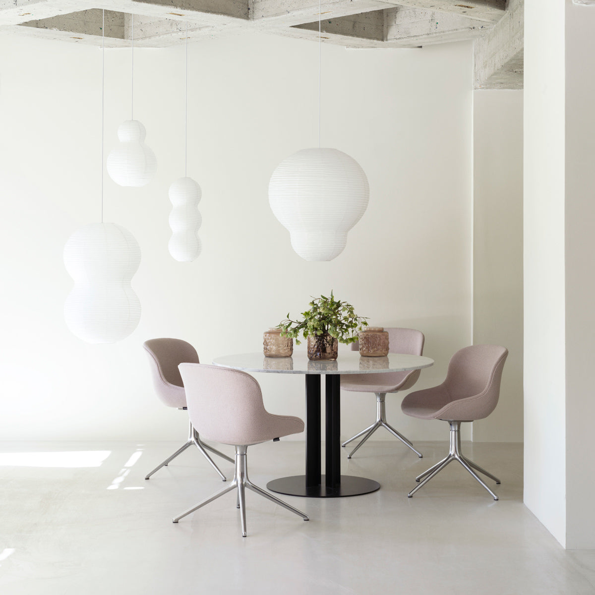 Hyg Swivel Chair by Normann Copenhagen, showing hyg swivel chairs in live shot.
