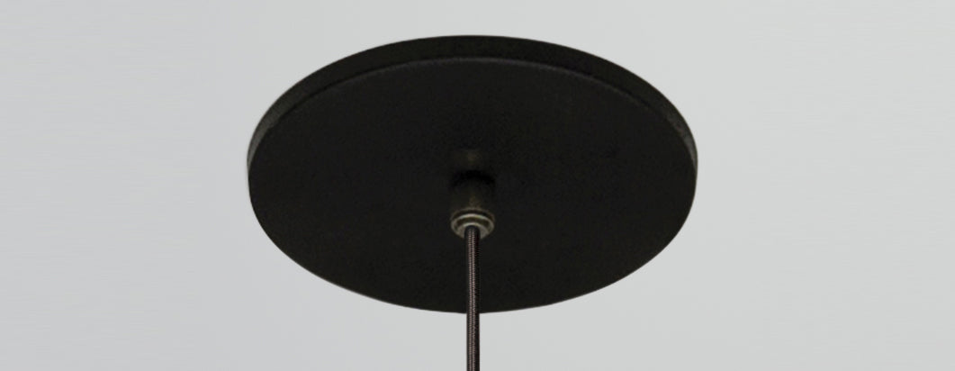 Ico 20" Pendant by Cerno, showing round canopy with black cloth covered cord for ico 20" pendant in live shot.