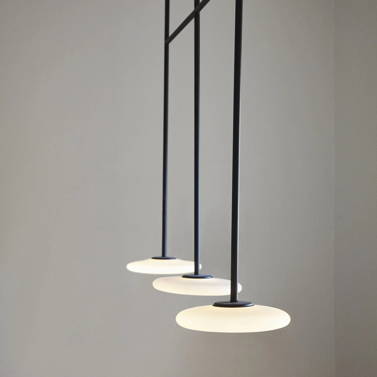 Ihana Pendant/Ceiling Light by Marset, showing closeup view of ihana pendant/ceiling light in live shot.