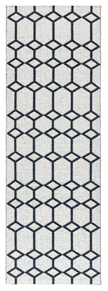 Ingrid Woven Plastic Rug by Brita, showing back view of ingrid woven plastic rug in black ingrid woven rug.