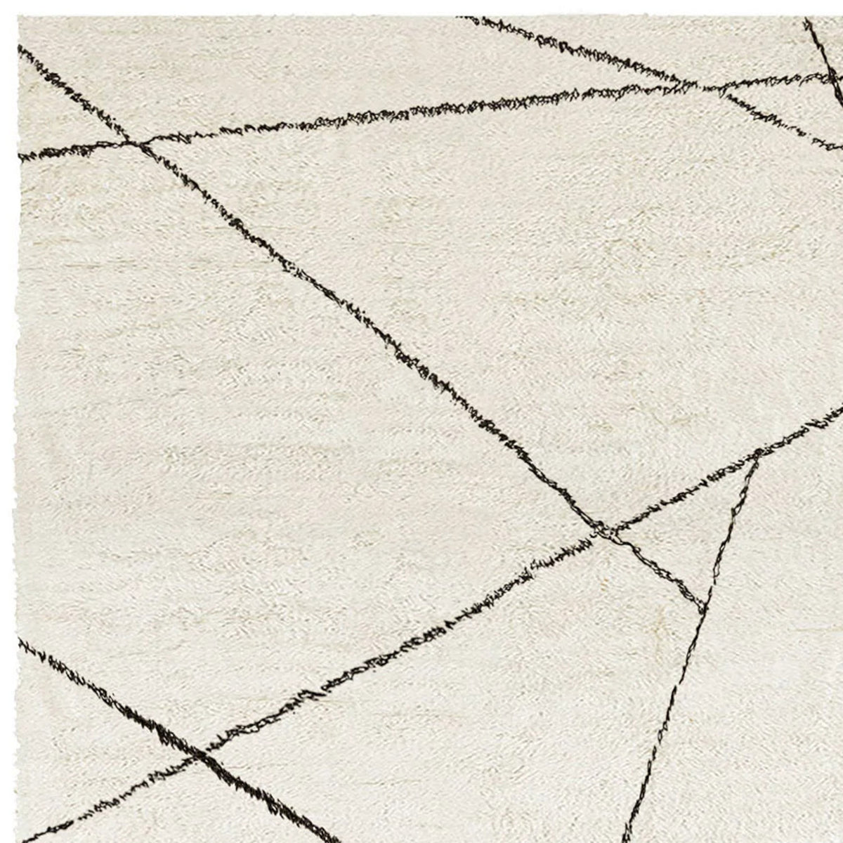 Issy Palesa Shaggy IY200 Rug by Second Studio, showing closeup view of issy palesa shaggy iy200 rug by second studio in cream & black.