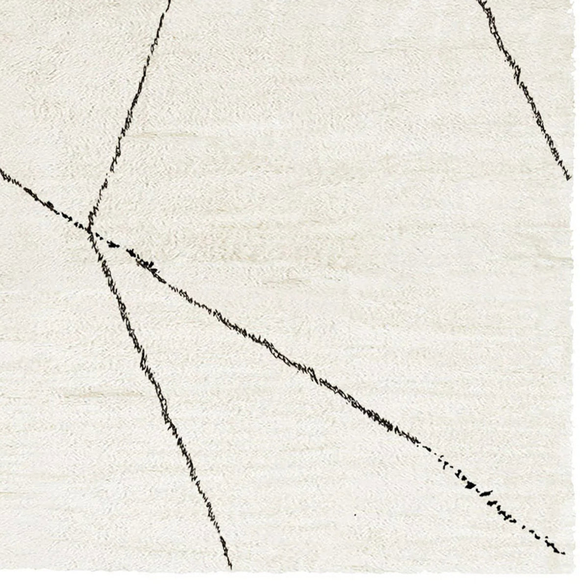 Issy Palesa Shaggy IY200 Rug by Second Studio, showing closeup view of issy palesa shaggy iy200 rug by second studio in cream & black.
