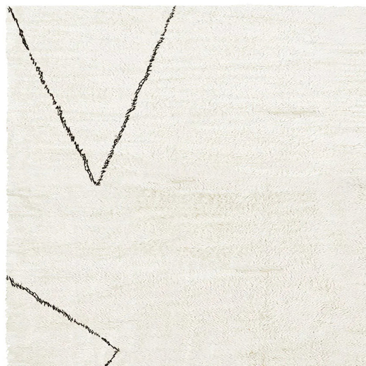 Issy Saville Shaggy IY300 Rug by Second Studio, showing closeup view of issy saville shaggy iy300 rug by second studio in cream & black.