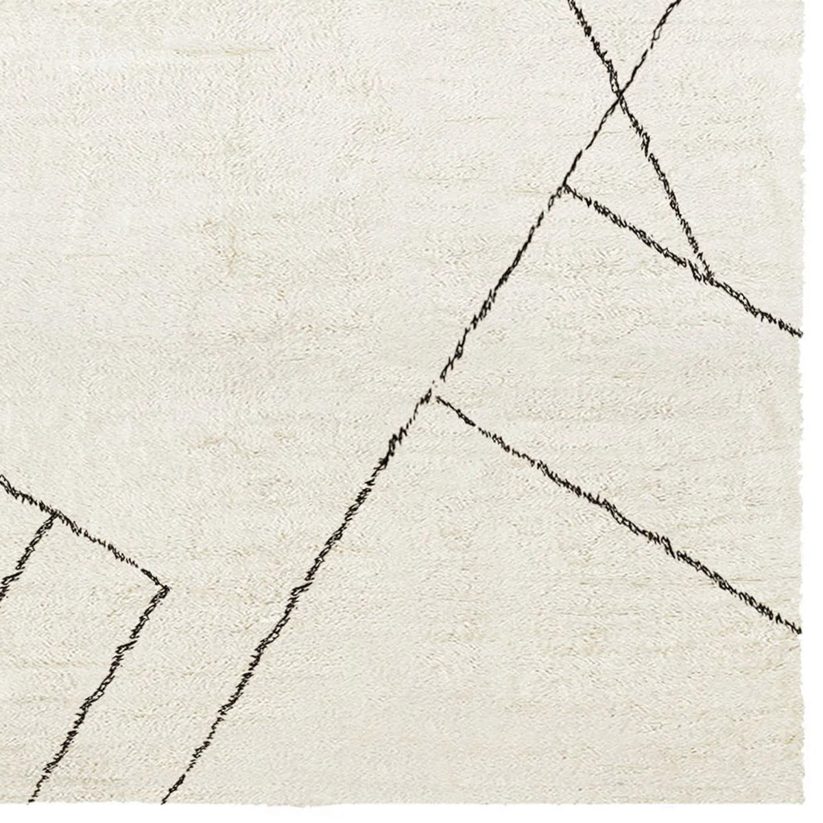 Issy Saville Shaggy IY300 Rug by Second Studio, showing closeup view of issy saville shaggy iy300 rug by second studio in cream & black.