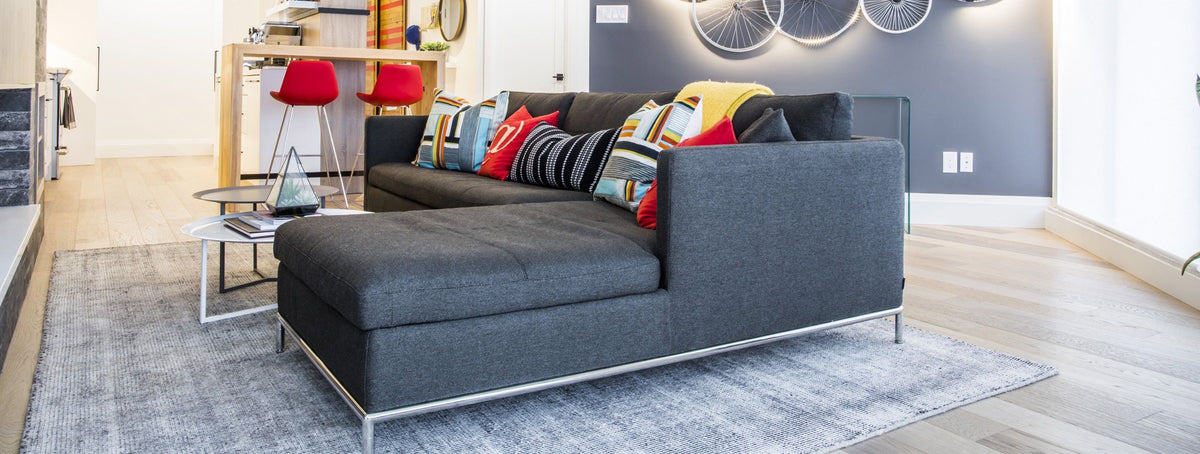Istanbul Sectional by SohoConcept, showing angle view of istanbul sectional with table in live shot.