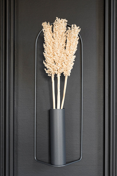 Itac Vase by Fermob, showing itac cylandrical vase in live shot.