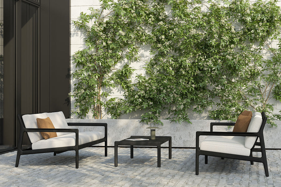 Jack Outdoor Coffee Table by Ethnicraft - showing outdoor coffee table in live shot.
