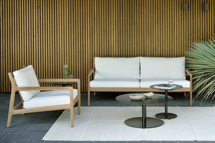 Jack Outdoor Sofa by Ethnicraft, showing jack outdoor sofa with chair & tables in live shot.