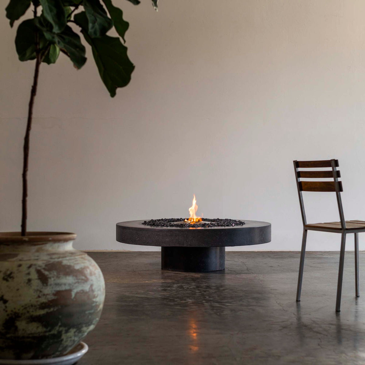 James De Wulf Floating Fire Table by De Wulf, showing floating fire table in live shot.