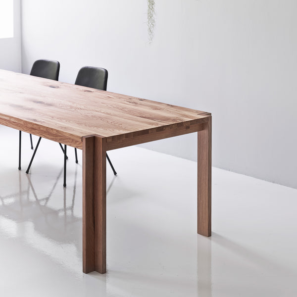 Jeppe Utzon Dining Table #1 by DK3 - showing closeup view of utzon dining table #1 in live shot.