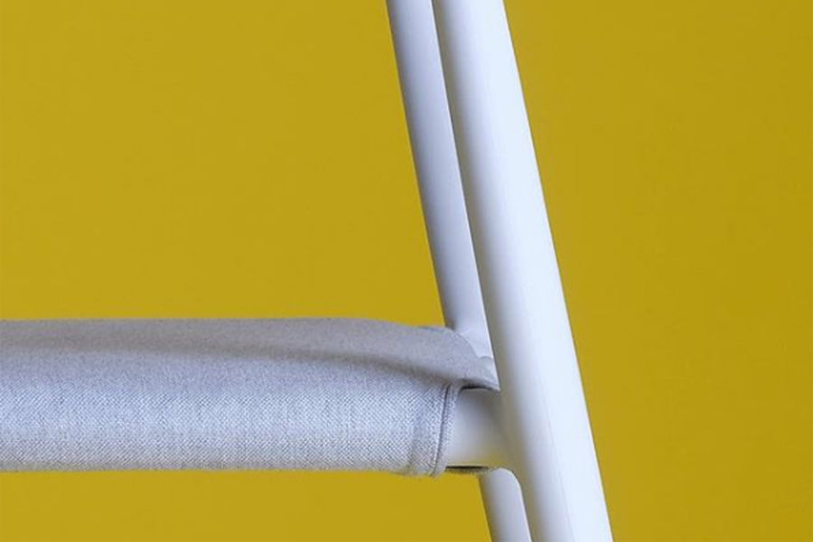 JOI Dining Chair by Toou, showing closeup view of joi dining chair in live shot.