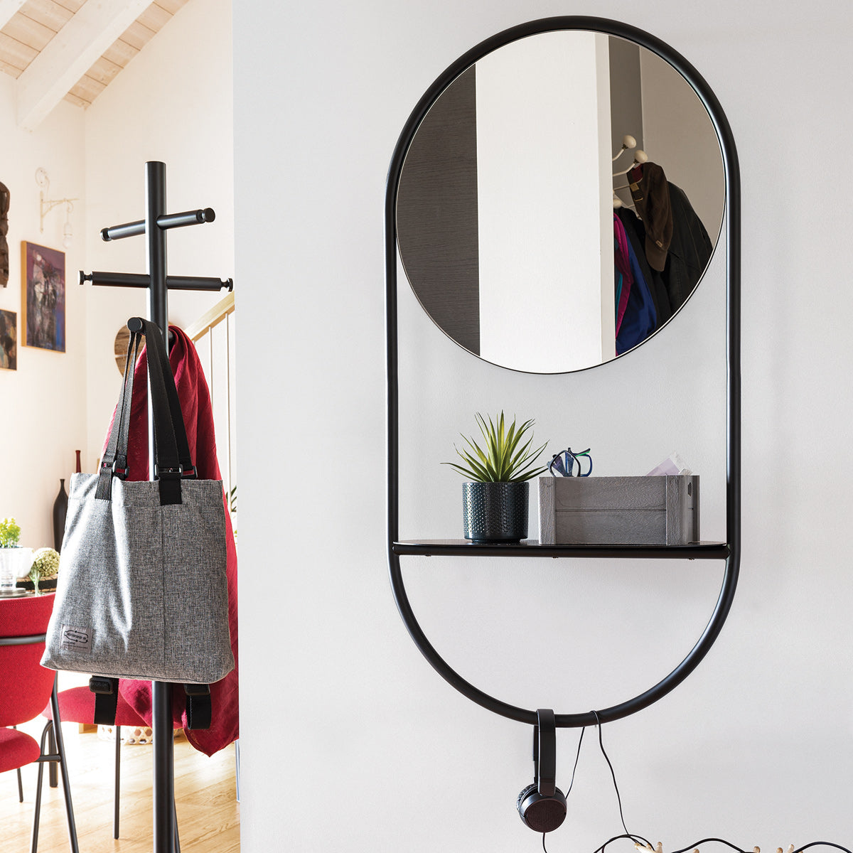 Juno Wall Mirror by Connubia, showing juno wall mirror in live shot.