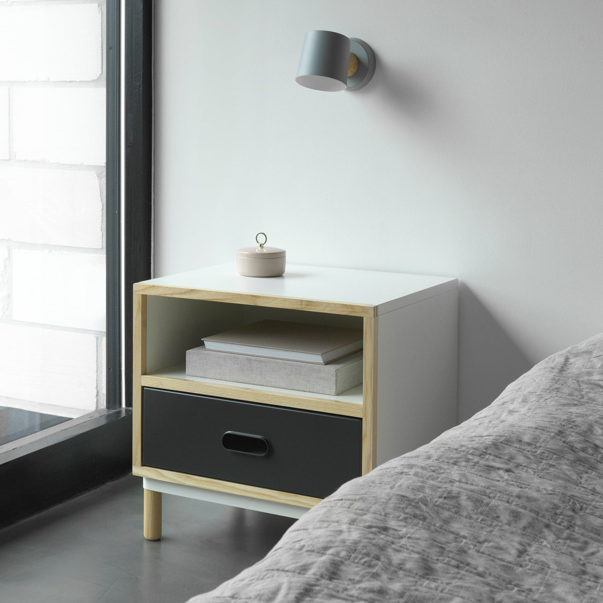 Kabino Bedside Table by Normann Copenhagen, showing kabino bedside table in live shot.