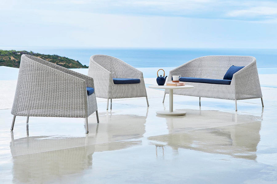 Kingston 2 Seater Stackable Lounge Sofa by Cane-Line, showing kingston 2 seater stackable lounge sofa in live shot.