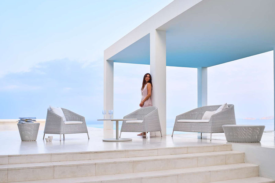 Kingston 2 Seater Stackable Lounge Sofa by Cane-Line, showing kingston 2 seater stackable lounge sofa in live shot.