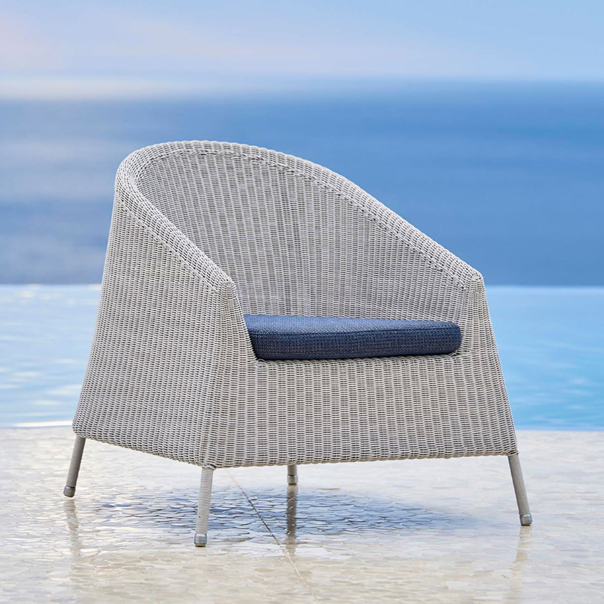 Kingston Lounge Chair by Cane-Line, showing kingston lounge chair in live shot.