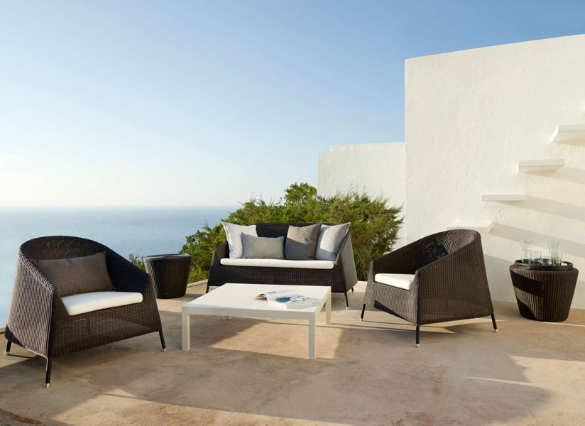 Kingston Lounge Chair by Cane-Line, showing kingston lounge chairs in live shot.