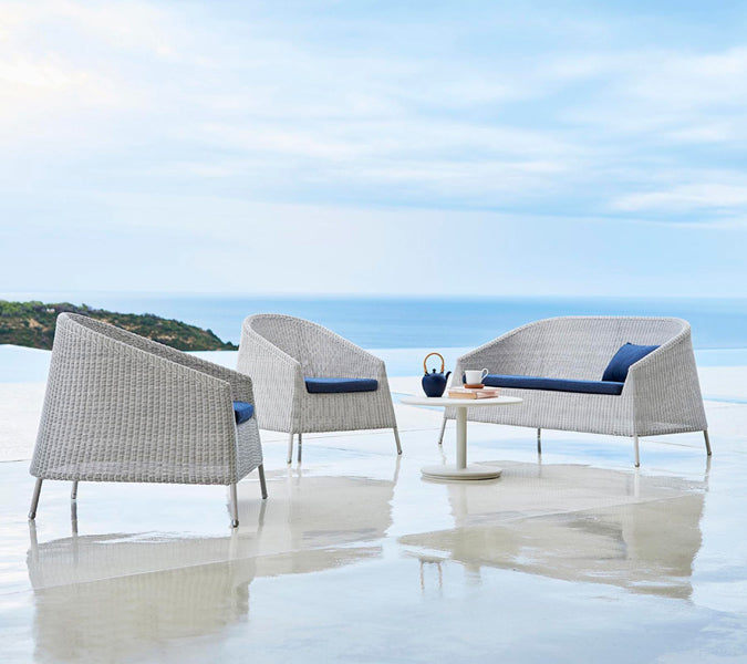 Kingston Lounge Chair by Cane-Line, showing kingston lounge chairs in live shot.