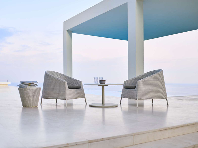 Kingston Lounge Chair by Cane-Line, showing kingston lounge chairs in live shot.