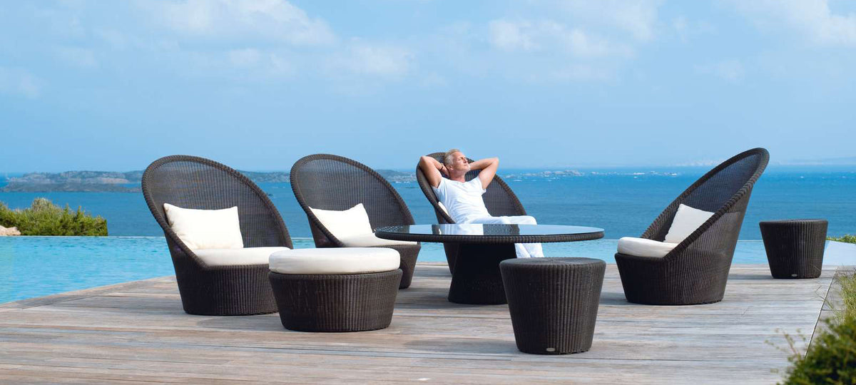 Kingston Sunchair with Wheels by Cane-Line, showing kingston sunchairs with wheels in live shot.