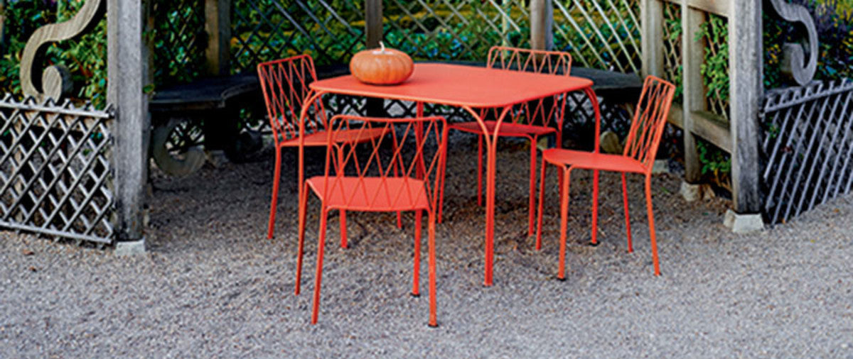 Kintbury Chair by Fermob, showing chairs with table in live shot.