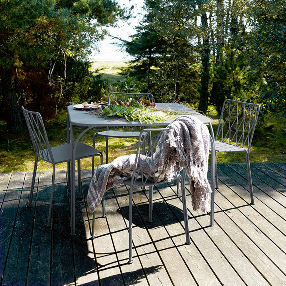 Kintbury Chair by Fermob, showing chairs with table in live shot.