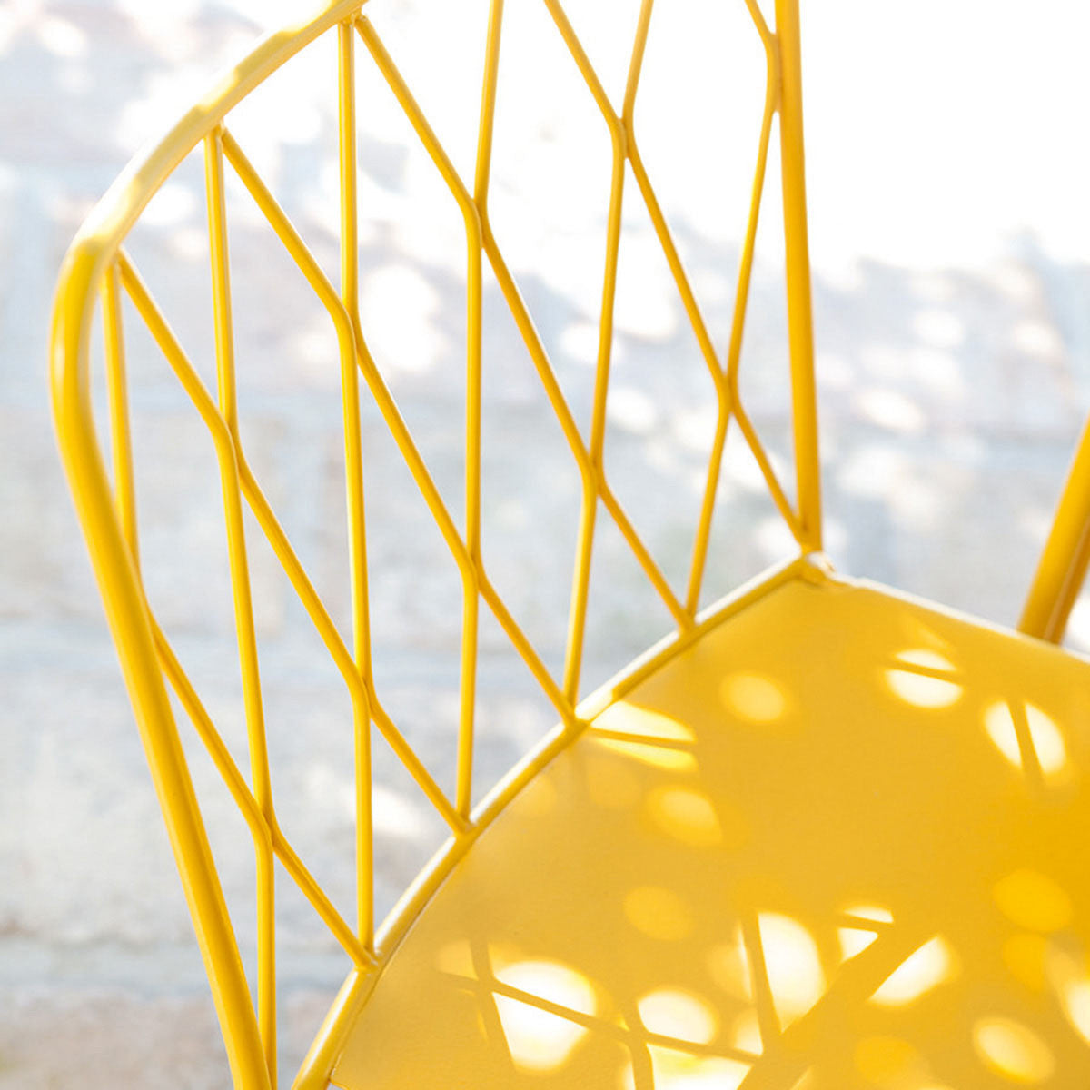 Kintbury Chair by Fermob, showing closeup view of chair in live shot.