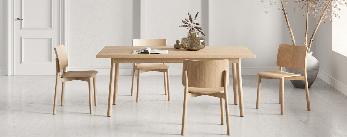 Mia Chair by Kollektiff, showing mia chair with table in live shot.
