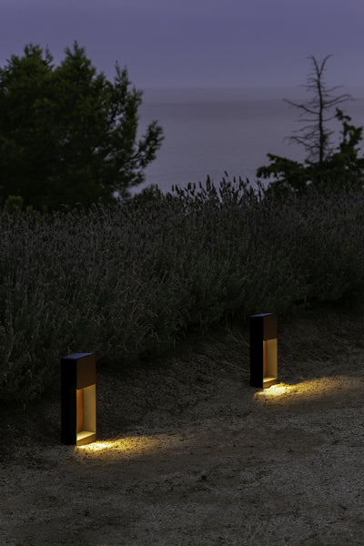 Lab B Bollard Outdoor Light by Marset, showing lab b bollard outdoor lights in live shot.