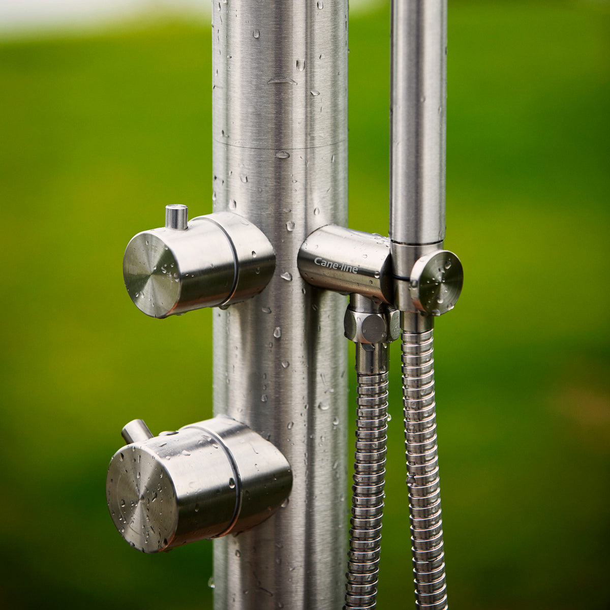 Lagoon Outdoor Stainless Steel Shower by Cane-Line , showing closeup view of lagoon outdoor stainless steel shower in live shot.