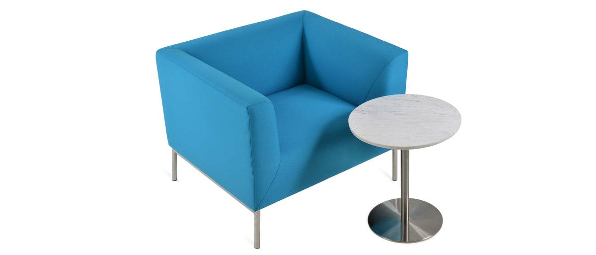 Laguna Armchair by SohoConcept, showing angle view of armchair with table.