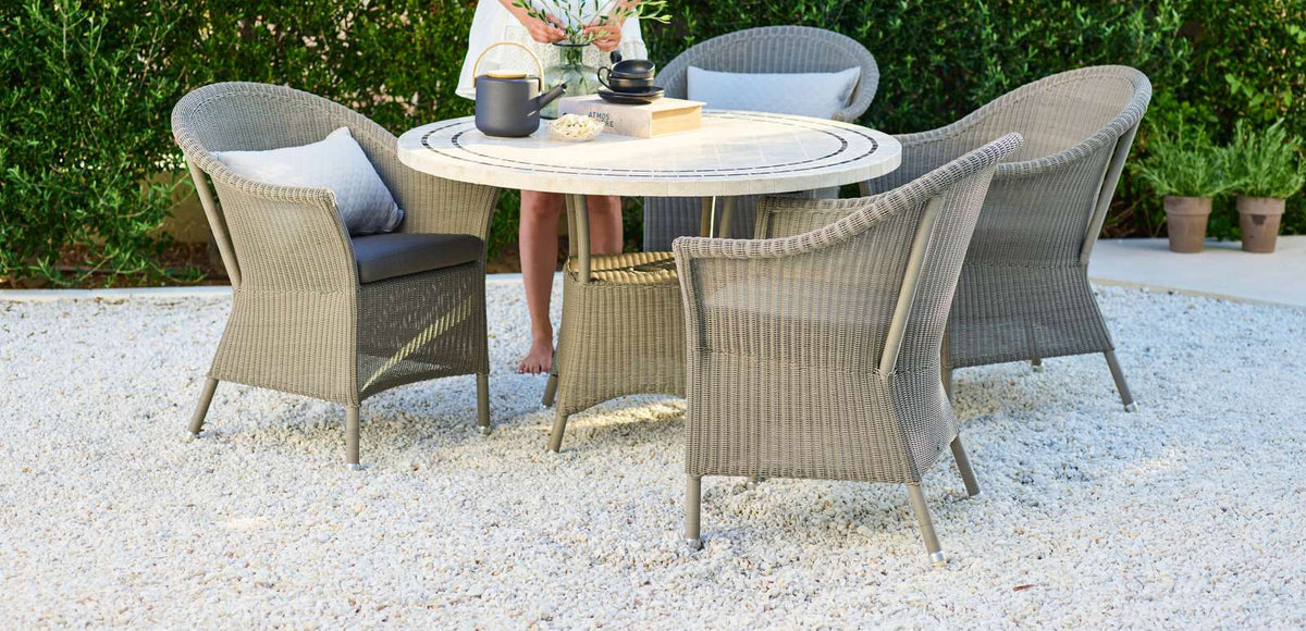 Lansing Dining Armchair by Cane-Line, showing lansing dining armchairs in live shot.