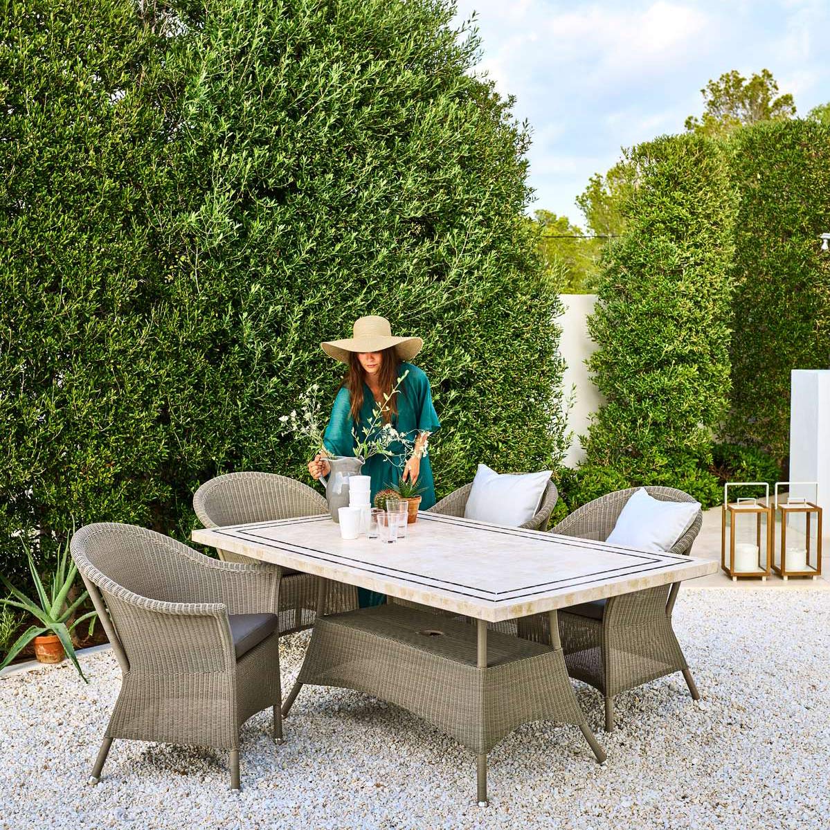 Lansing Dining Armchair by Cane-Line, showing lansing dining armchairs in live shot.