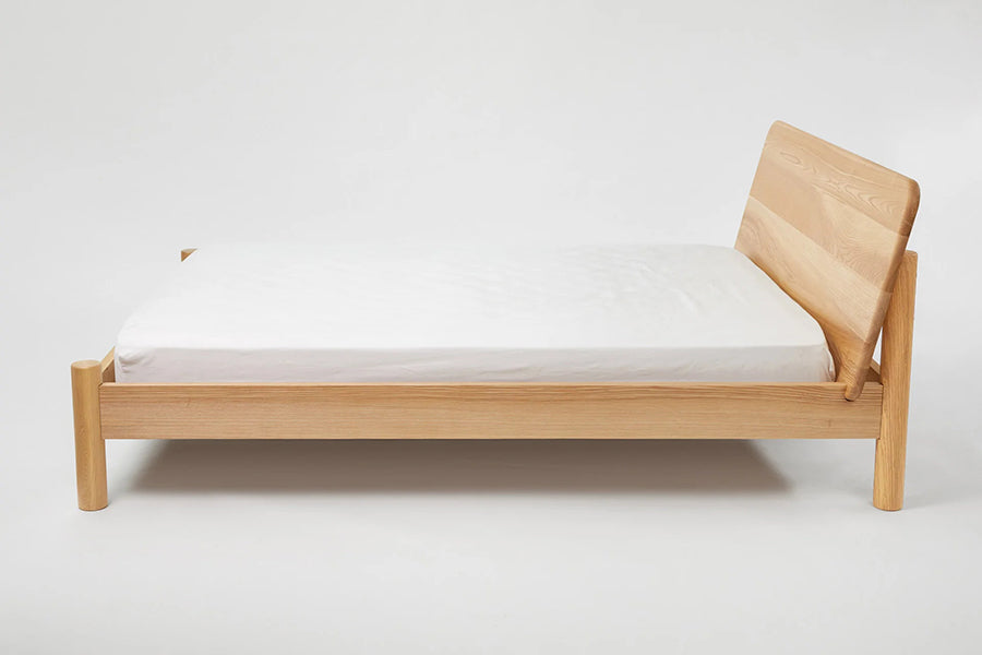 LAX Milk Bed by MASHstudios, showing side view of lax milk bed in solid ash wood.
