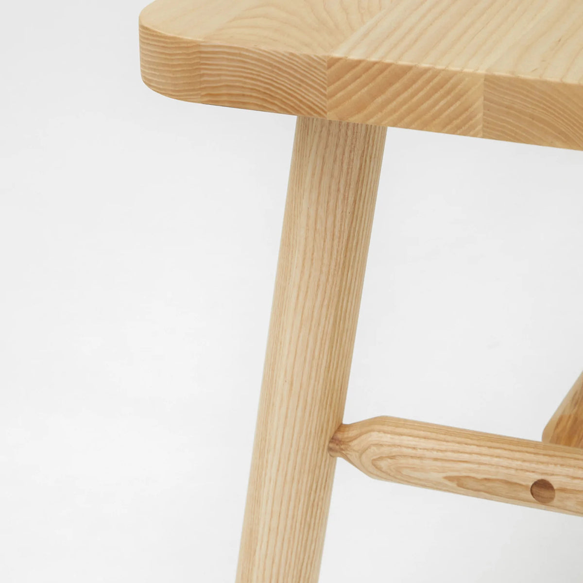 LAX Milk Bench by MASHstudios, showing closeup view of lax milk bench in solid ash wood.