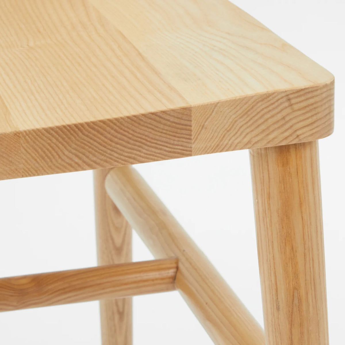 LAX Milk Dining Chair by MASHstudios, showing closeup view of lax milk dining chair in solid ash wood.