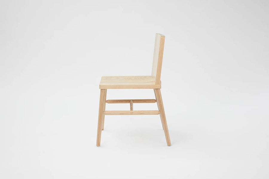 LAX Milk Dining Chair by MASHstudios, showing side view of lax milk dining chair in solid ash wood.