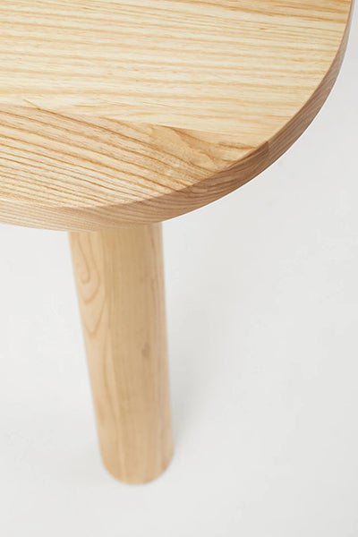 LAX Milk Dining Table by MASHstudios, showing closeup view of lax milk dining table in solid ash wood.