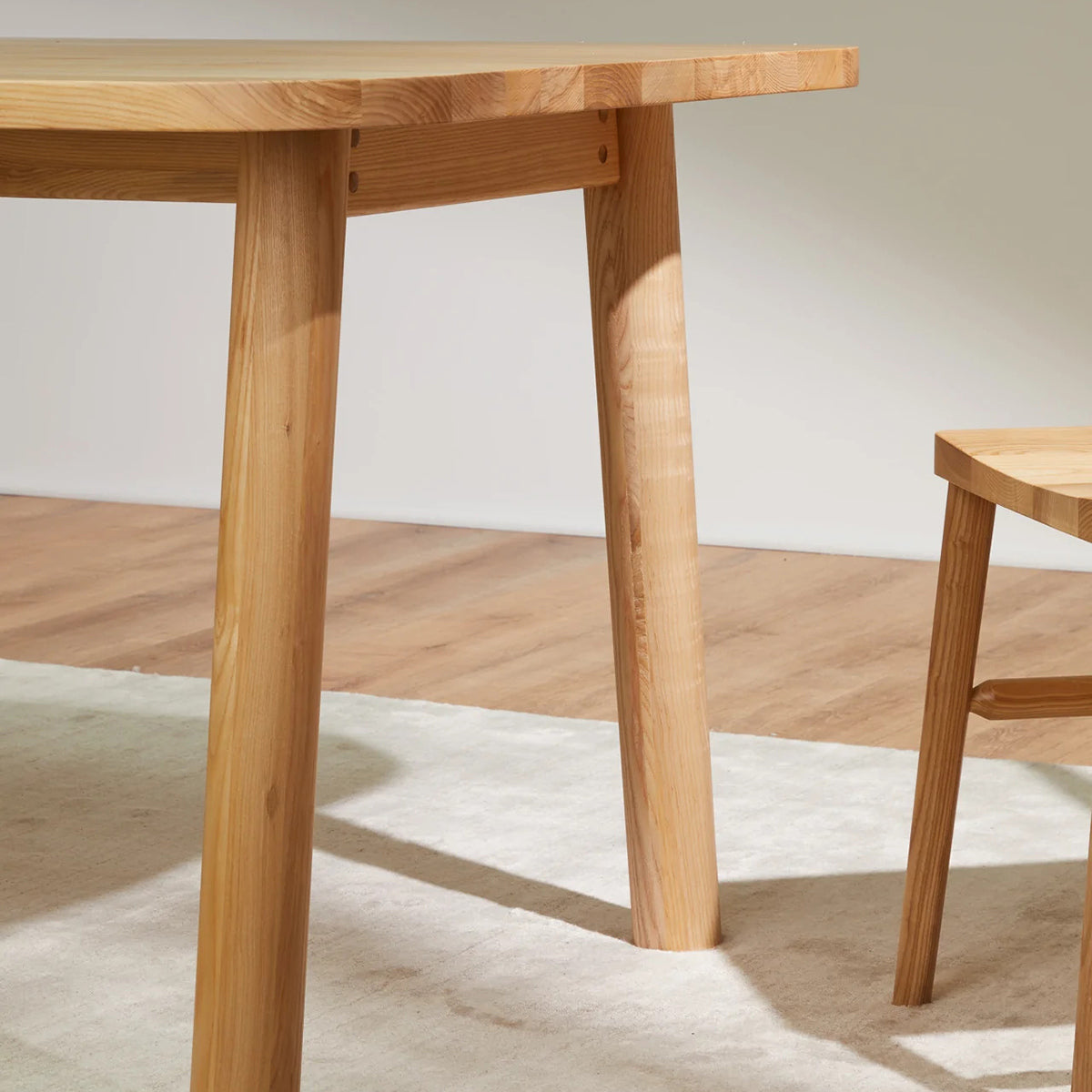 LAX Milk Dining Table by MASHstudios, showing closeup view of lax milk dining table in live shot.