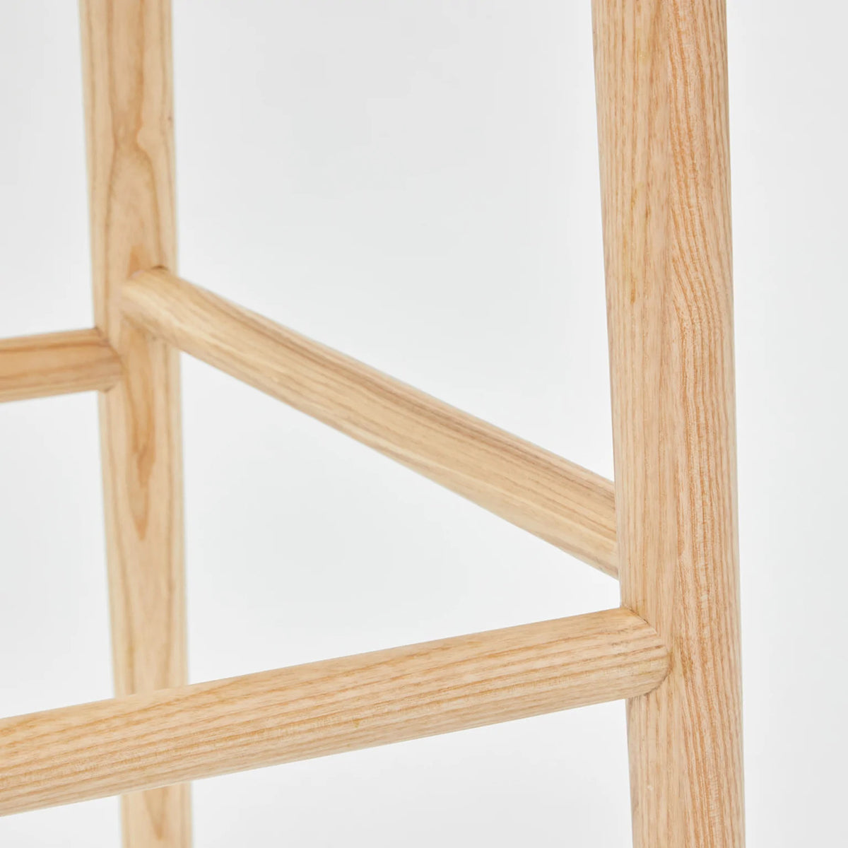 LAX Milk Stool by MASHstudios, showing closeup view of lax milk stool in solid ash wood.