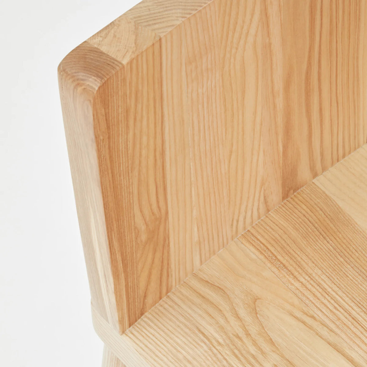 LAX Milk Stool by MASHstudios, showing closeup view of lax milk stool in solid ash wood.
