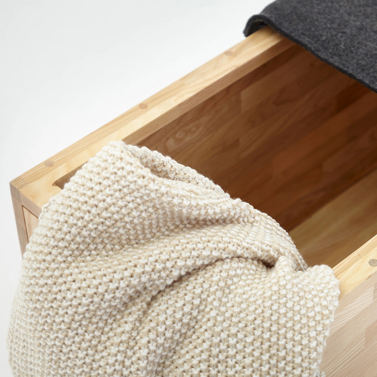 Storage Bench by MASHstudios, showing closeup view of lax storage bench in live shot.