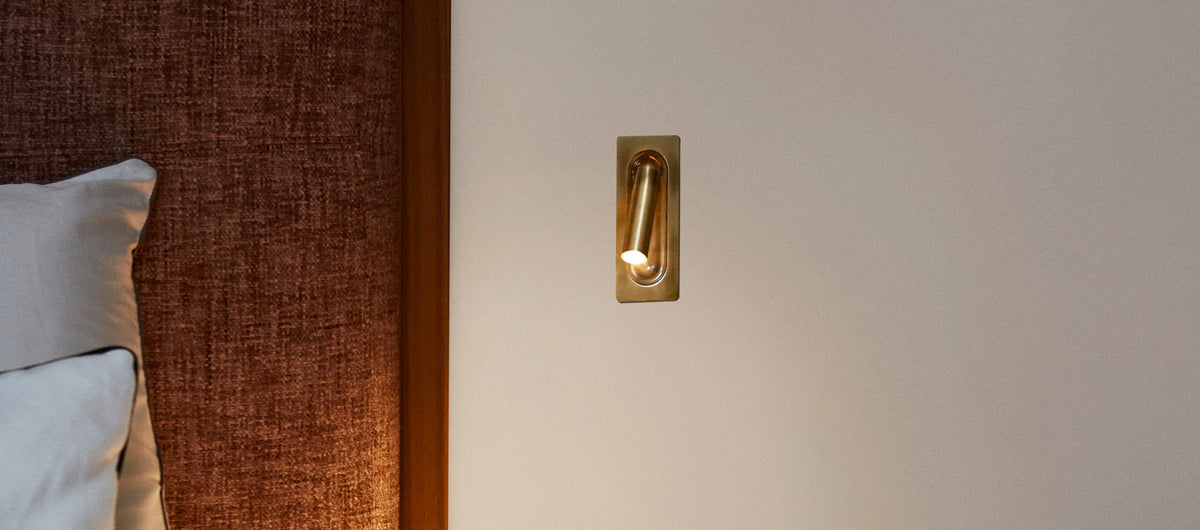 Ledtube Reading Mini Wall Lamp by Marset, showing ledtube reading mini wall lamp in live shot.