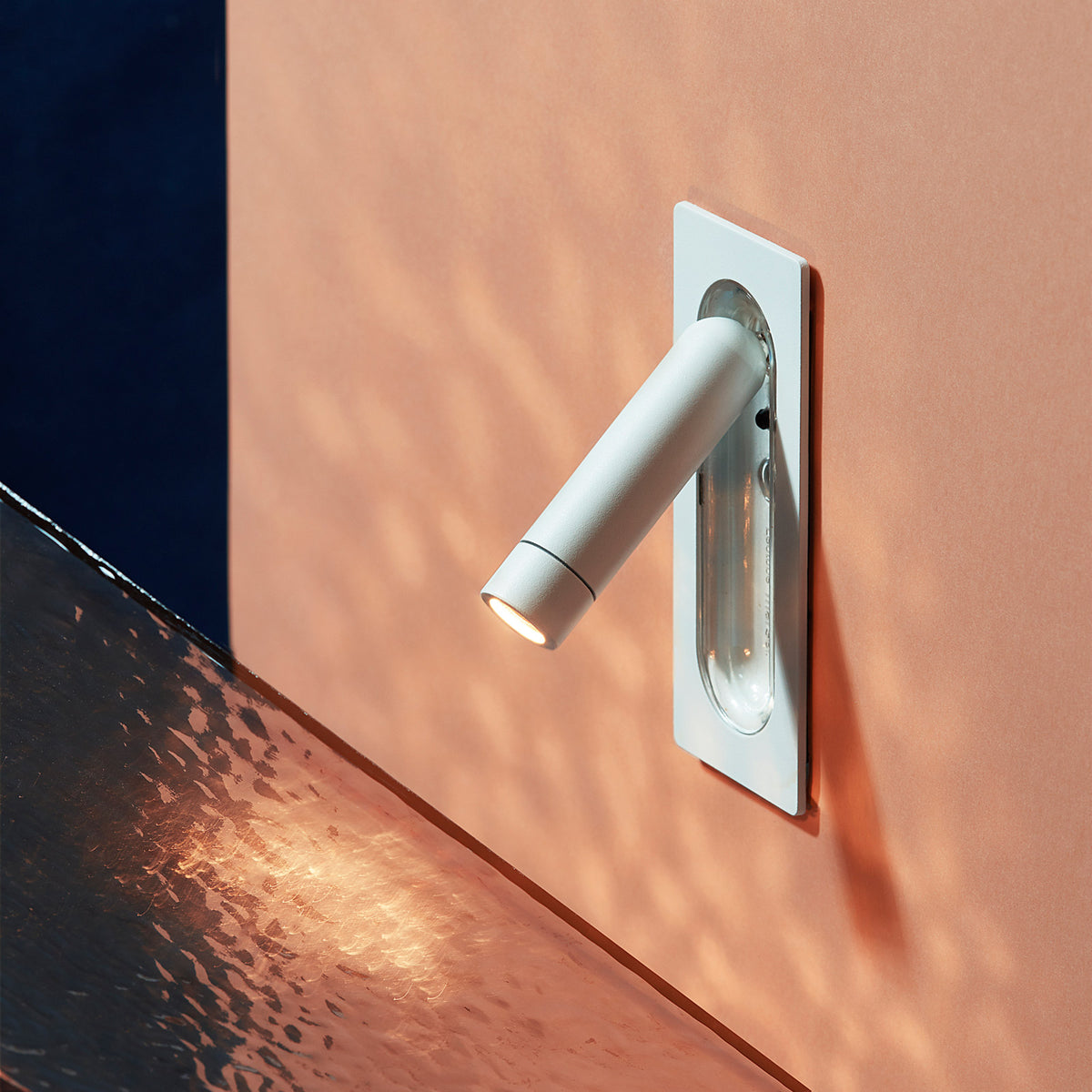 Ledtube Reading Mini Wall Lamp by Marset, showing ledtube reading mini wall lamp in live shot.