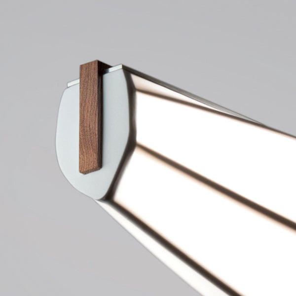 Lenis LED Linear Pendant by Cerno, showing closeup view of lenis led linear pendant in walnut wood.