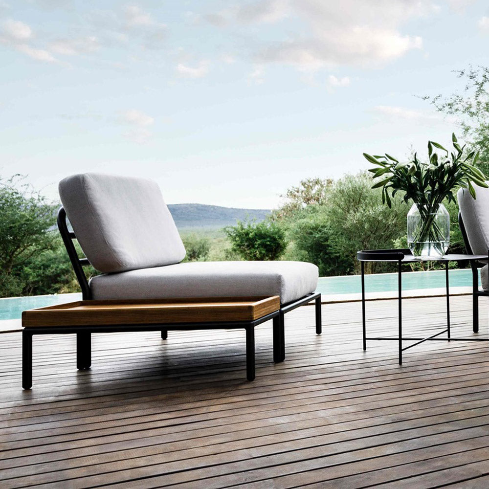 Level 2 End Table by Houe, showing level 2 end table with lounge chair in live shot.