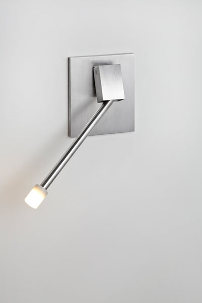 Libri LED Reading Sconce by Cerno, showing left libri led reading sconce with brushed aluminum backplate in live shot.