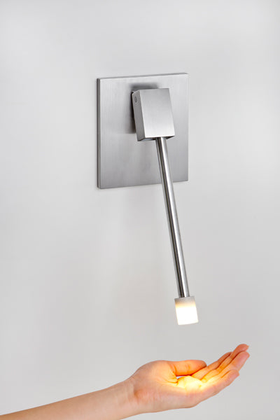 Libri LED Reading Sconce by Cerno, showing left libri led reading sconce with brushed aluminum backplate in live shot.