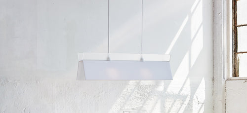 Lido Pendant by Gus Modern, showing lido pendant with table & benches in live shot.