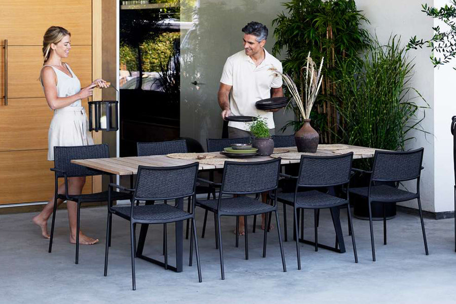 Lightlux Lantern with Teak Handle by Cane-Line, showing lightlux langern with teak handle in live shot.